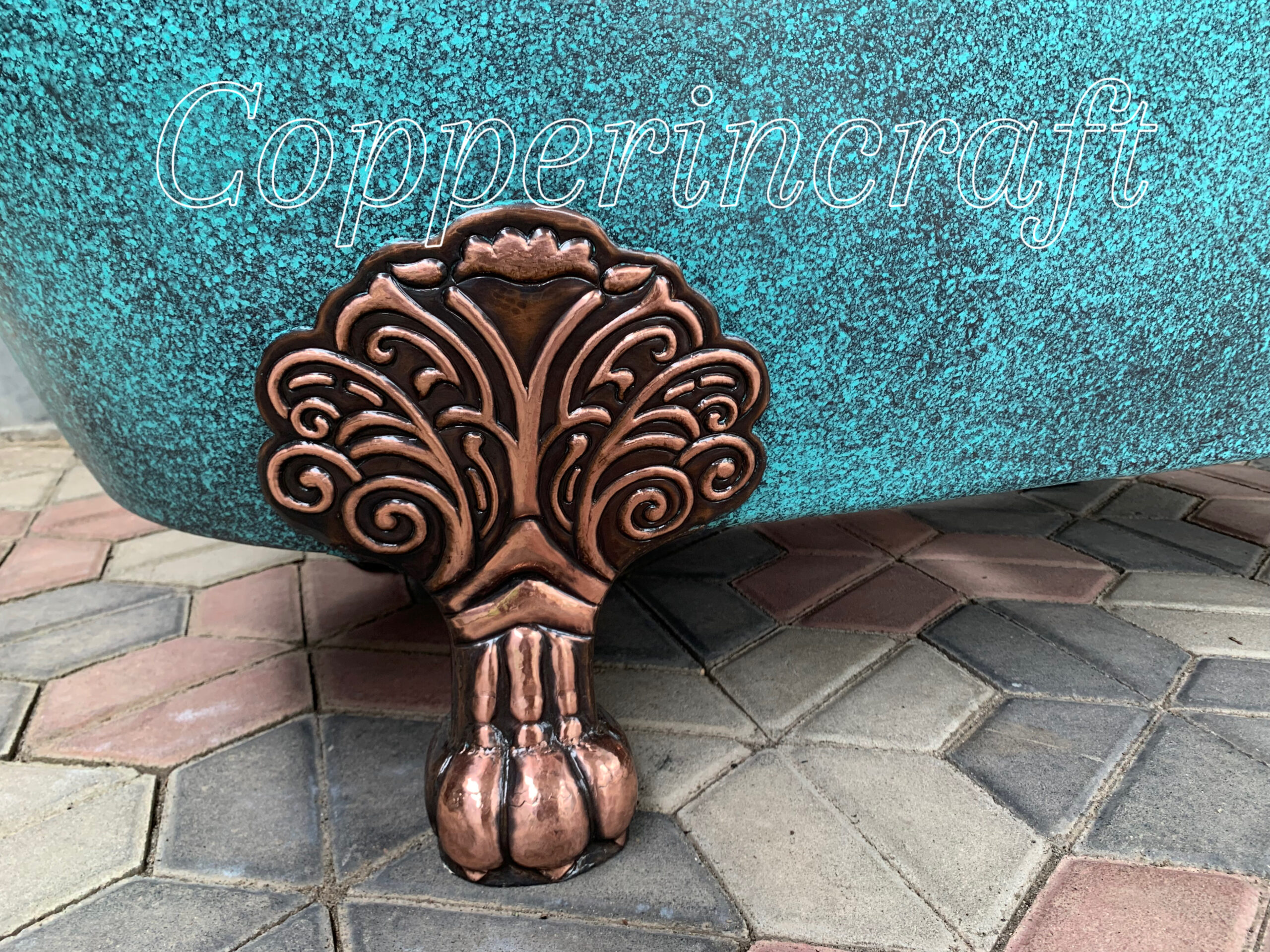 Vintage copper soaking tub with ornate claw feet, handcrafted pure copper bathtub for luxury bathroom design.